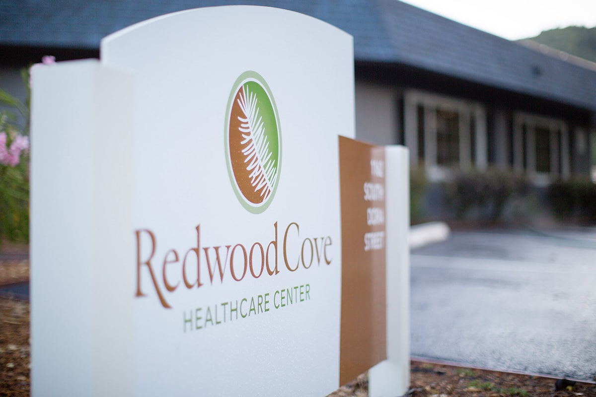 Close up of Redwood Cove's front of facility sign.