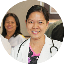 smiling nurse wearing a stethoscope